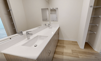 A bathroom with a large sink and a mirror.